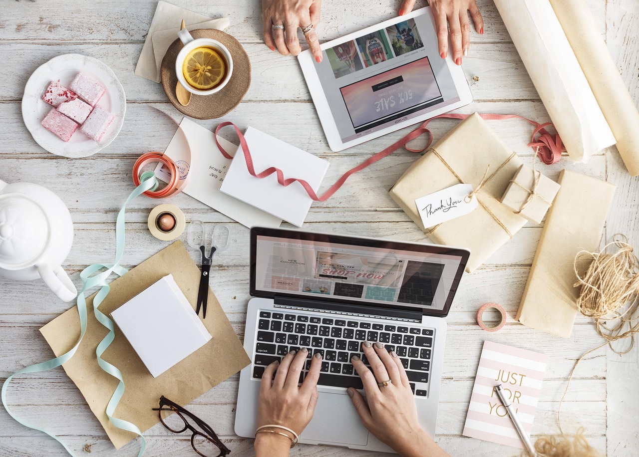 Creative workspace with laptop and crafts