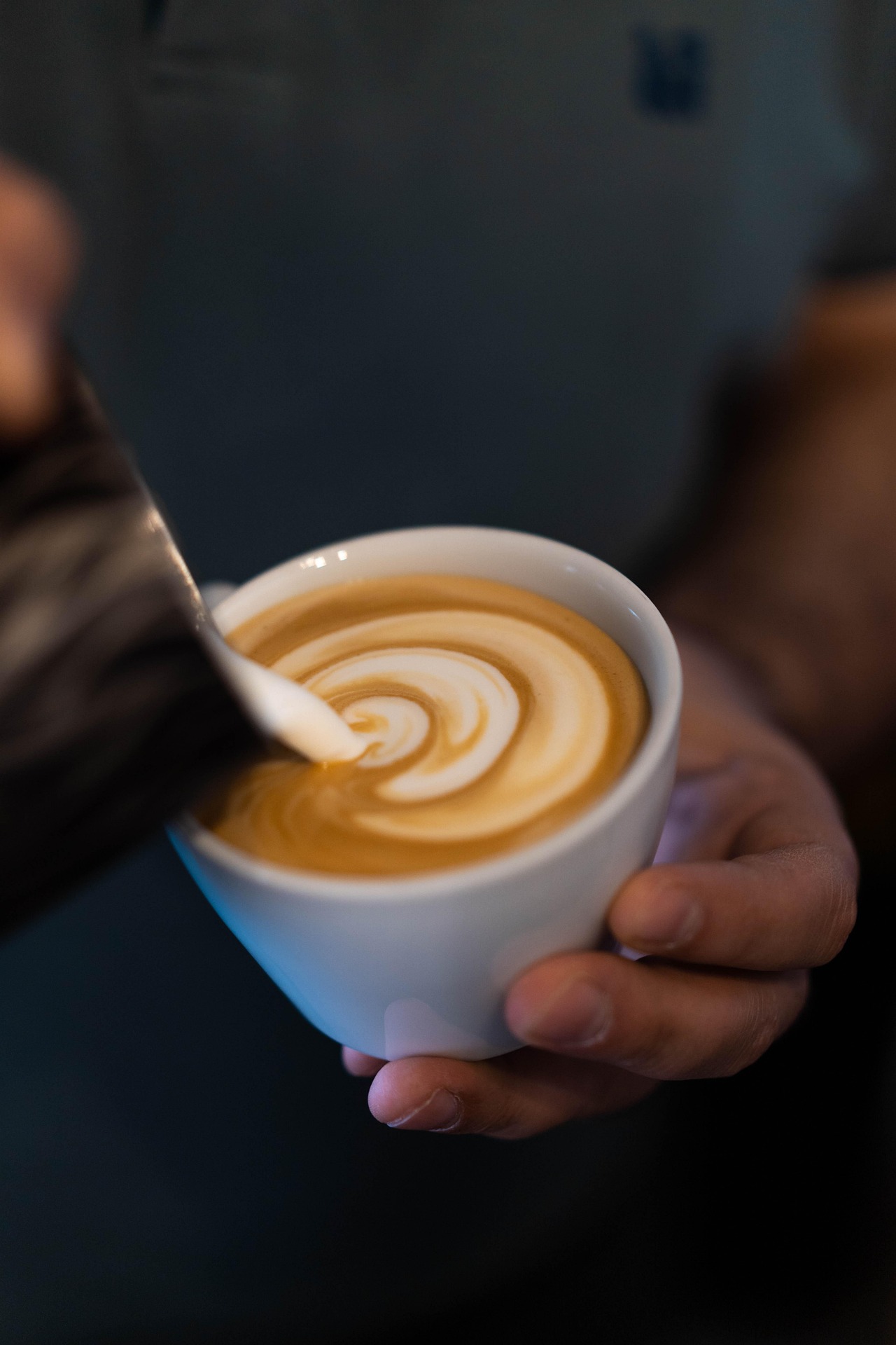 Barista pouring latte art