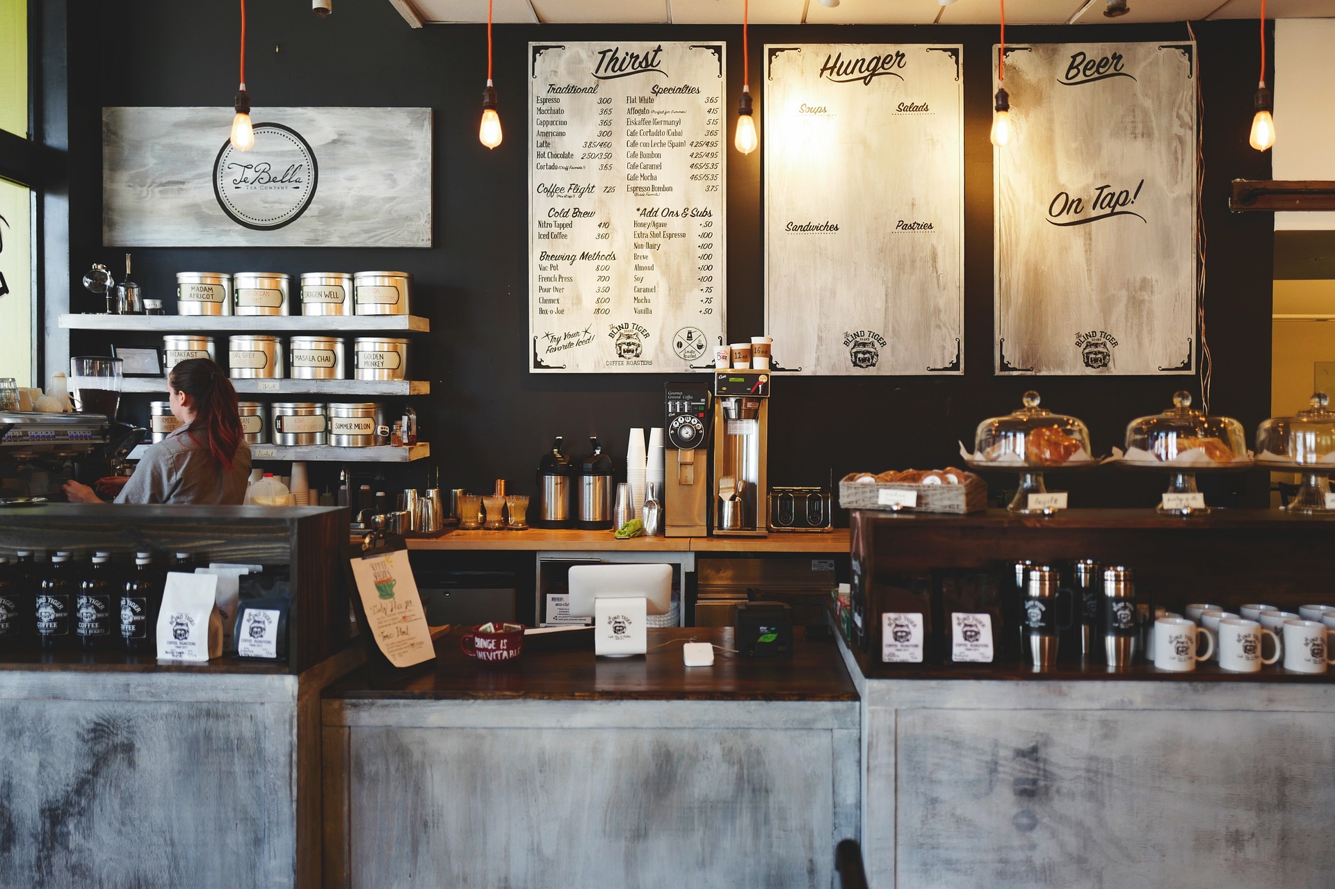 Midtown coffee bar glowing with pendant lights