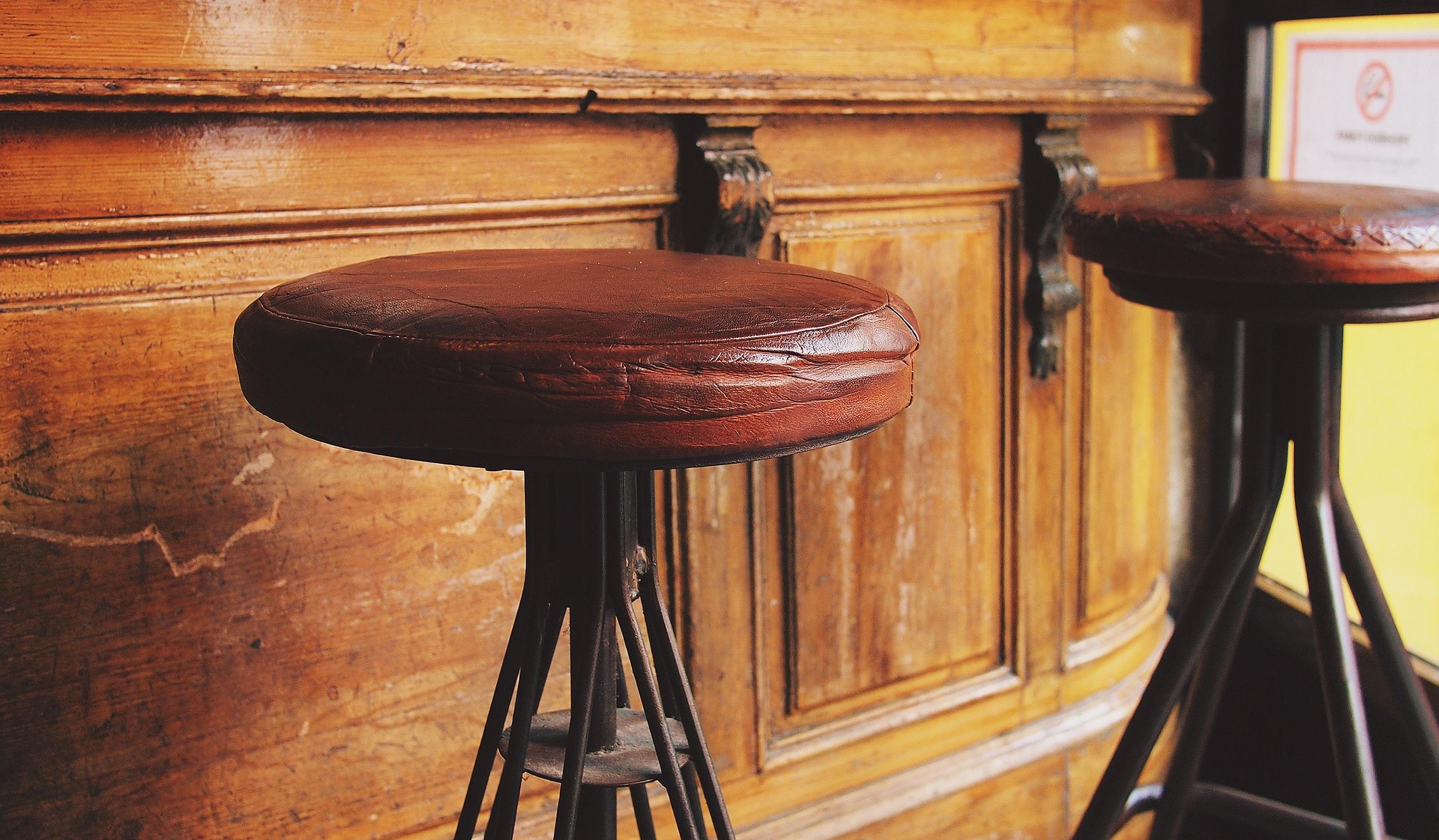 Riverfront brew bar with wooden stools and pendant lights
